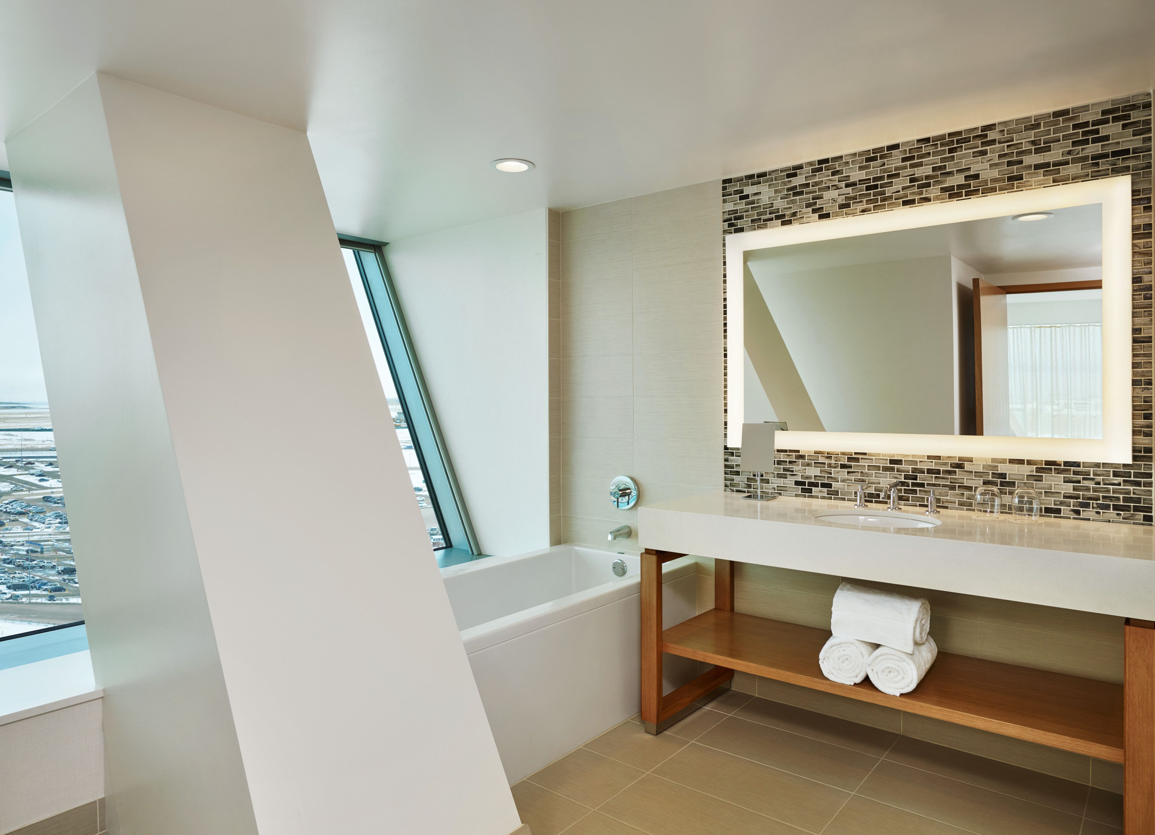 hydromassage showerhead, designer toiletries, bathrobes, slippers