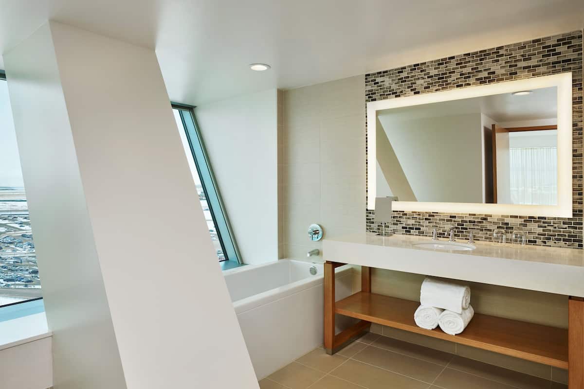 hydromassage showerhead, designer toiletries, bathrobes, slippers