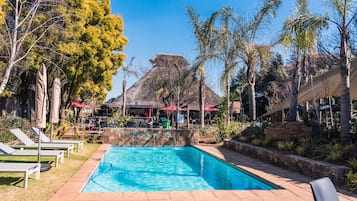 Outdoor pool, open 7:00 AM to 7:00 PM, pool umbrellas, sun loungers