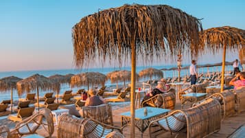 On the beach, sun-loungers, beach umbrellas
