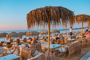 On the beach, sun loungers, beach umbrellas