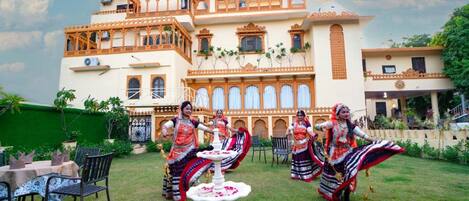 A traditional building with multiple balconies and a central courtyard.