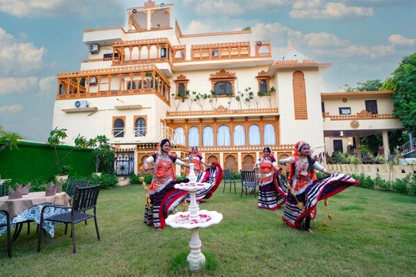 A traditional building with multiple balconies and a central courtyard.
