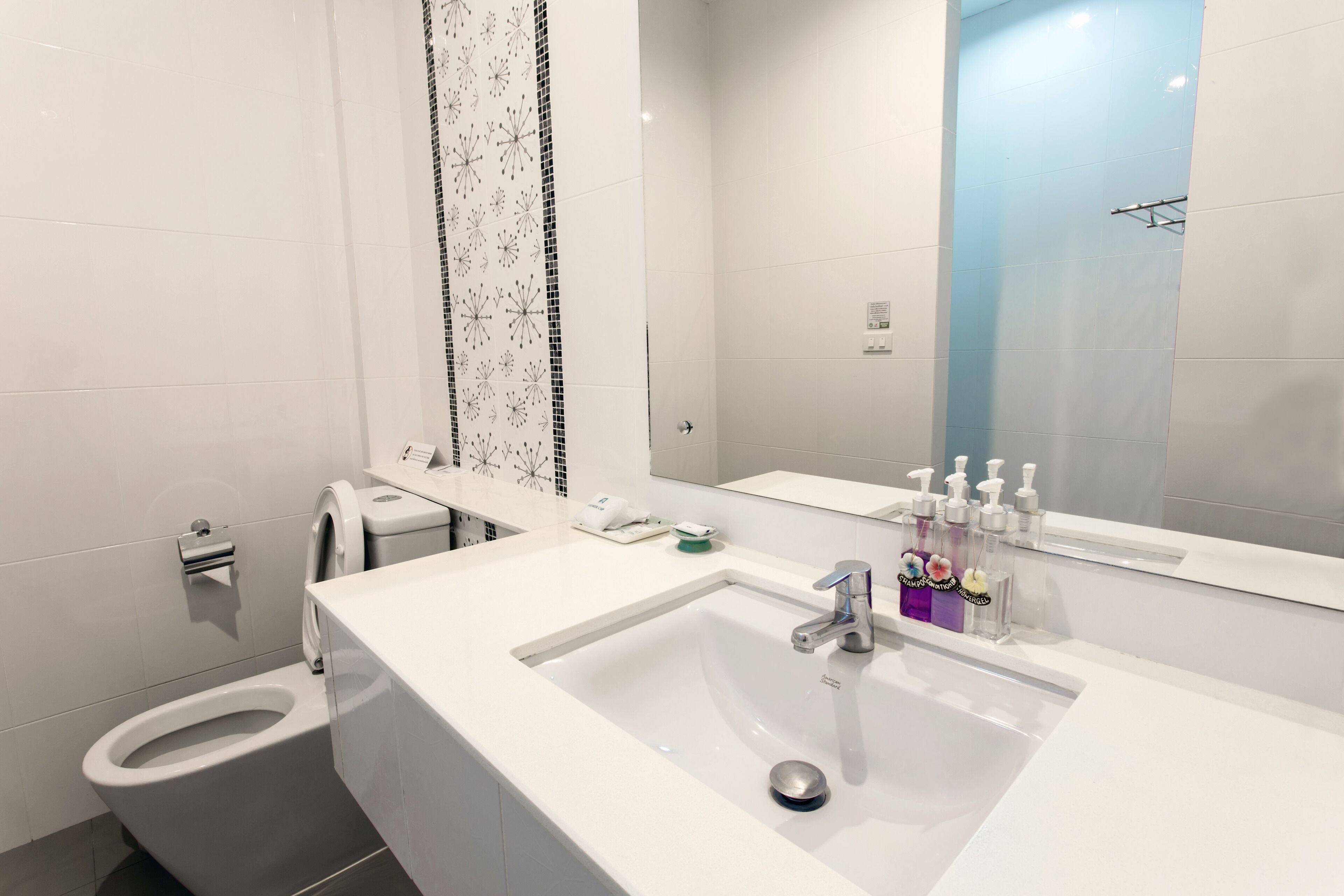boutique room | bathroom | shower, free toiletries, hair dryer, bathrobes