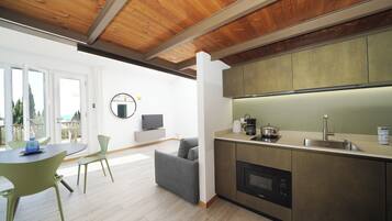 Studio, Lake View | Living area | TV