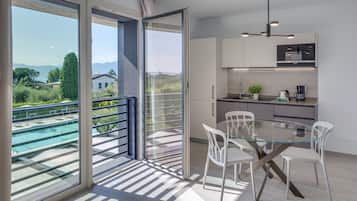 Deluxe Apartment, 1 Bedroom | Living area | TV