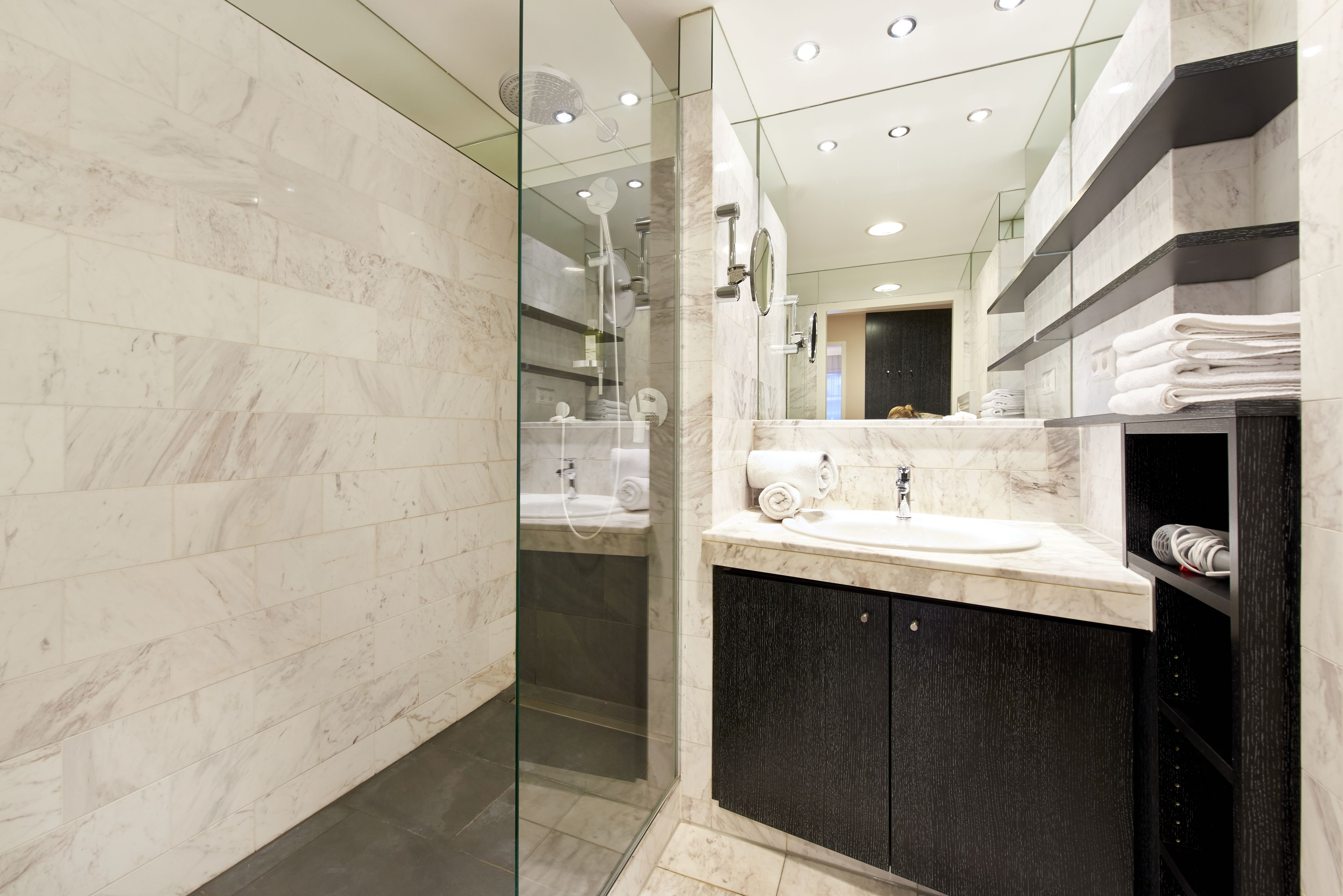 Shower, hair dryer, slippers, towels