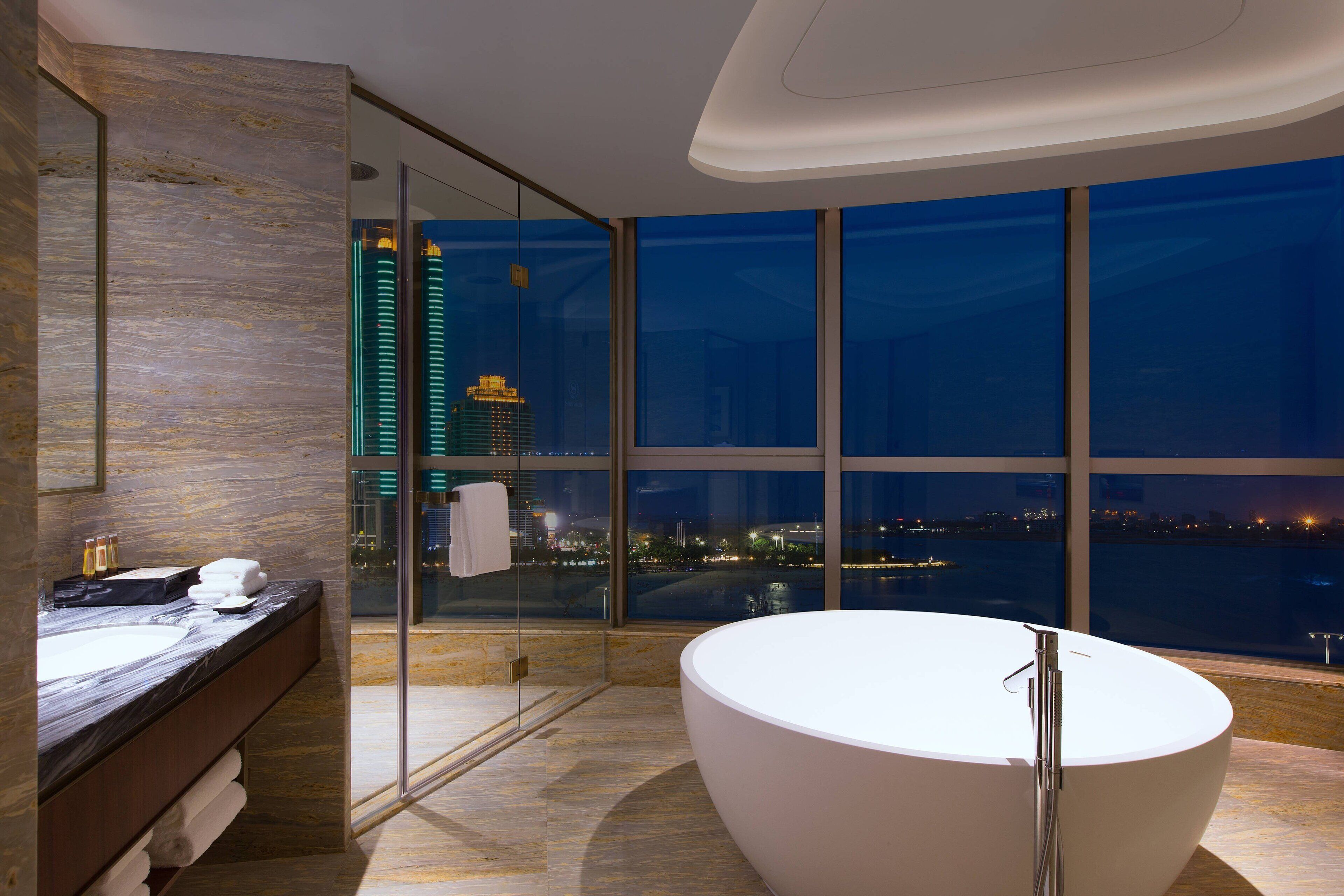club suite, 1 king bed, sea view | bathroom | rainfall showerhead, free toiletries, hair dryer, bathrobes