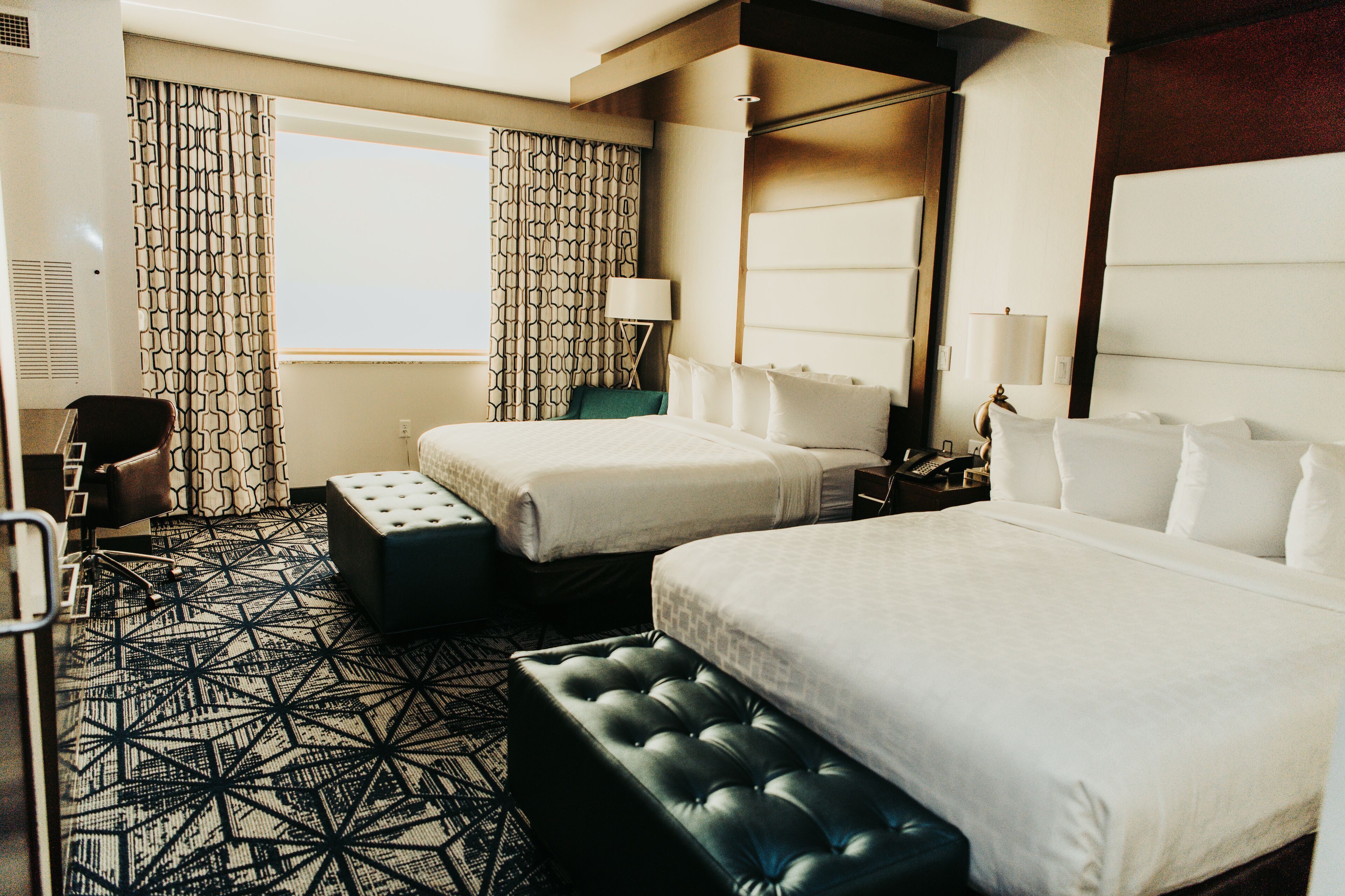 deluxe room, 2 queen beds | premium bedding, down duvets, pillow-top beds, in-room safe