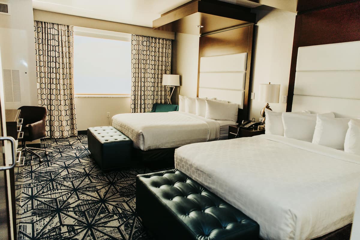 deluxe room, 2 queen beds | premium bedding, down duvets, pillow-top beds, in-room safe