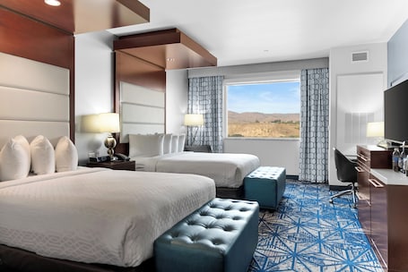 Premium bedding, down comforters, pillowtop beds, in-room safe