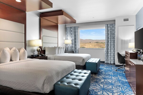 Premium bedding, down comforters, pillowtop beds, in-room safe