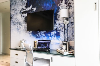 Hotel amenities such as safe, desk and work area at Wyndham Garden Brooklyn Sunset Park