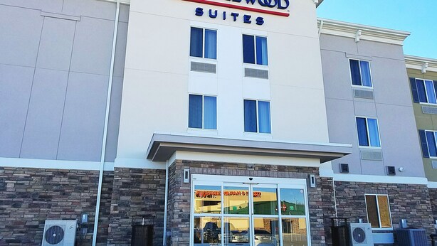 A hotel named Candlewood Suites with a modern facade, large windows, and a clear entrance. - Candlewood Suites MORGANTOWN-UNIV WEST VIRGINIA by IHG (Morgantown)