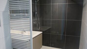 Shower, free toiletries, hair dryer, slippers
