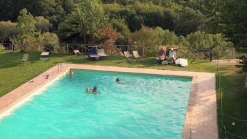 Seasonal outdoor pool, open 8:00 AM to 8:00 PM, pool umbrellas