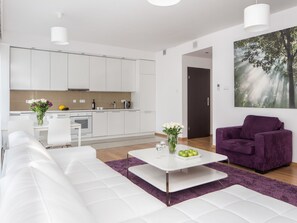 Family Apartment, 2 Queen Beds | Living area | 42-inch flat-screen TV with cable channels, TV
