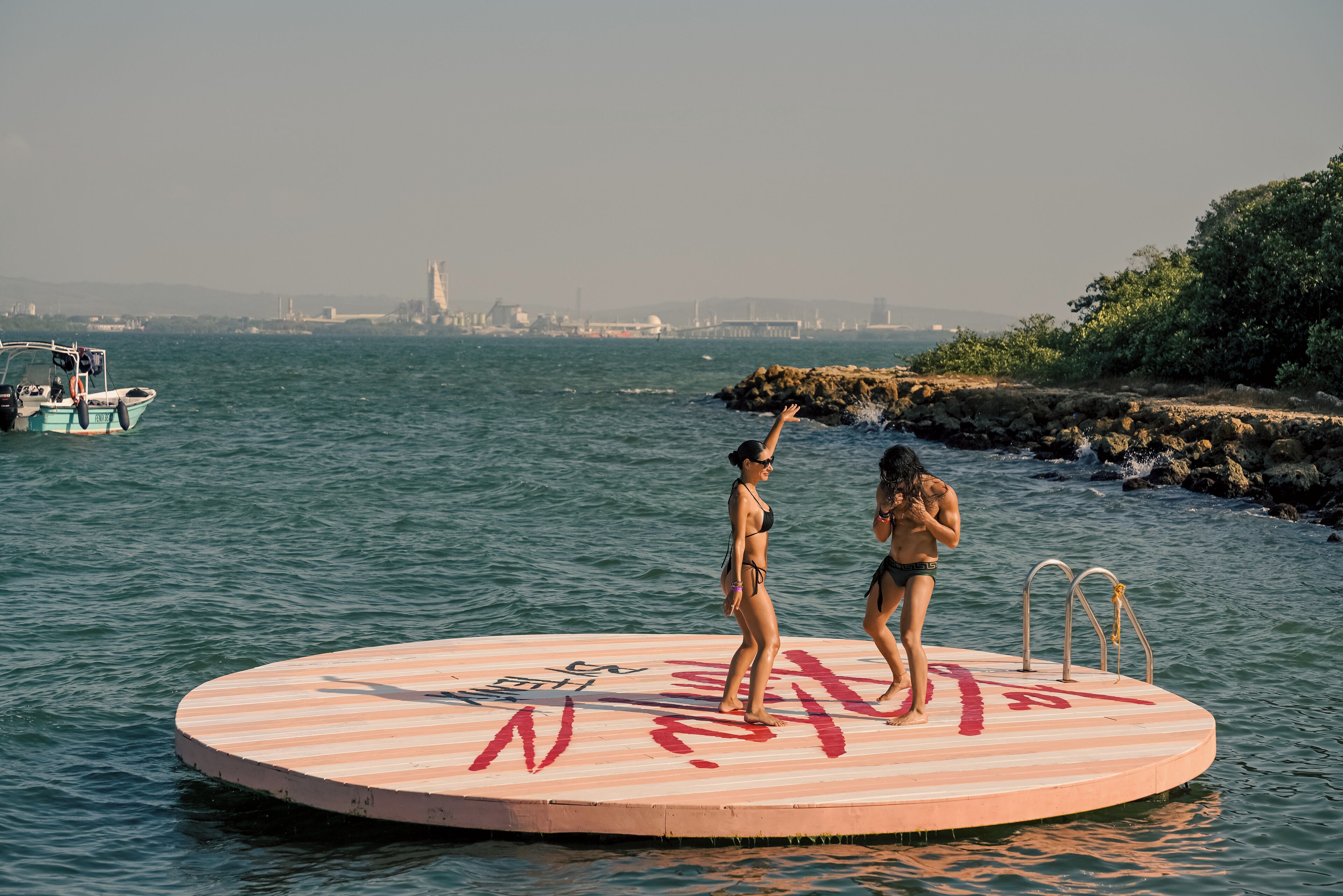 on the beach, white sand, beach cabanas, sun-loungers