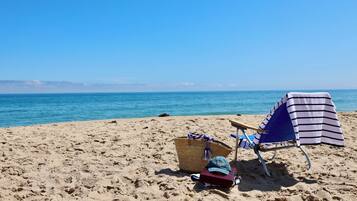 Beach nearby, white sand, beach towels