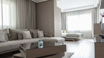 Junior Suite | 1 bedroom, in-room safe, desk, iron/ironing board