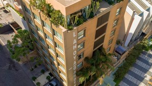 A multi-story building with balconies, a sign reading "LAHOYAL GARDEN," and surrounding greenery. -  Lahoya Beirut (Beirut)