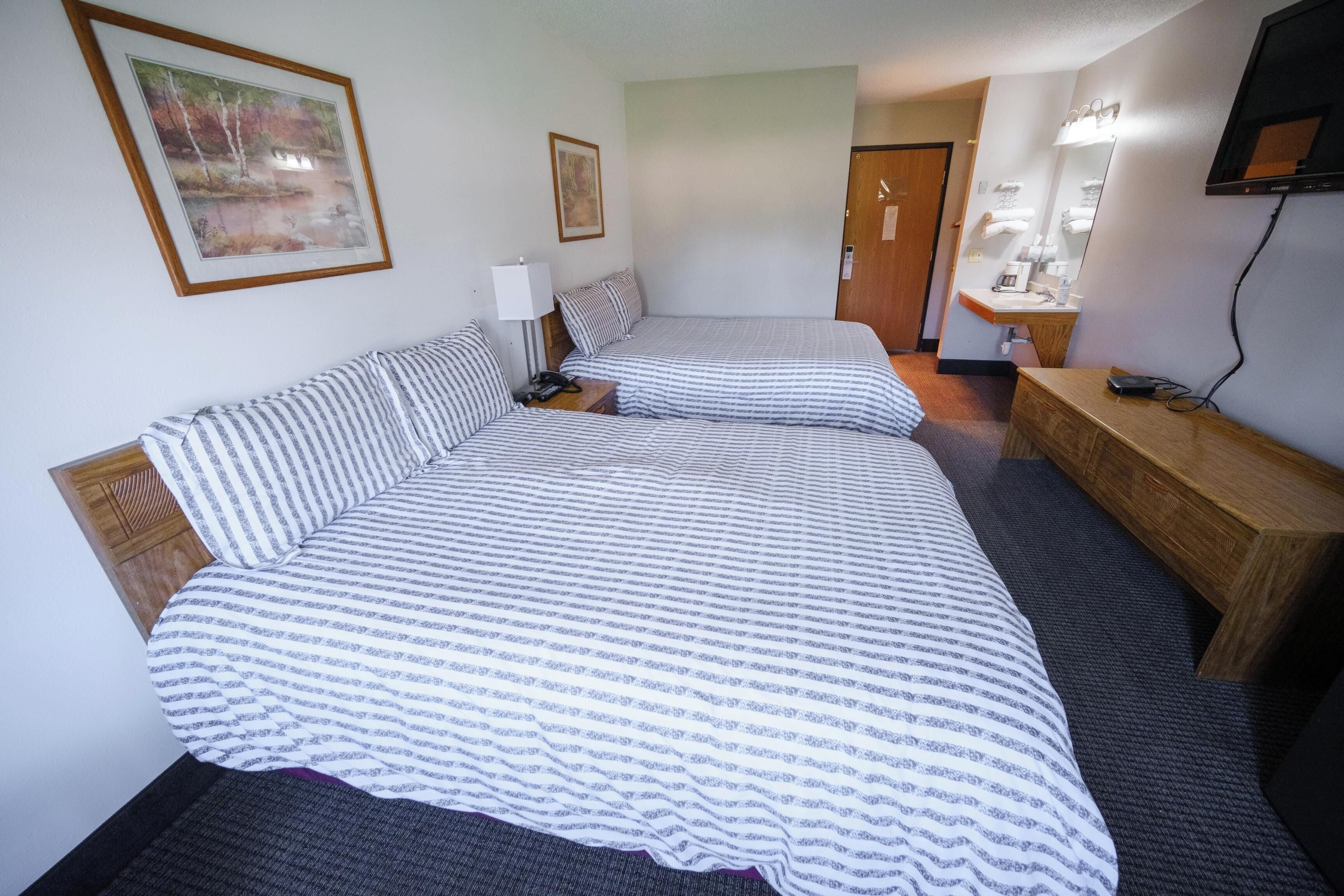 Suite, Non Smoking (1 King & 1 Queen) | Desk, iron/ironing board, free WiFi, bed sheets