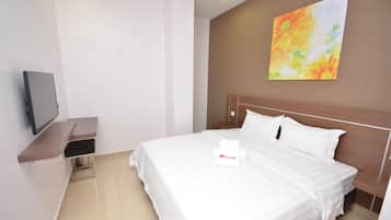 A hotel room with a bed, a TV on a stand, a painting on the wall, and a towel with a logo.