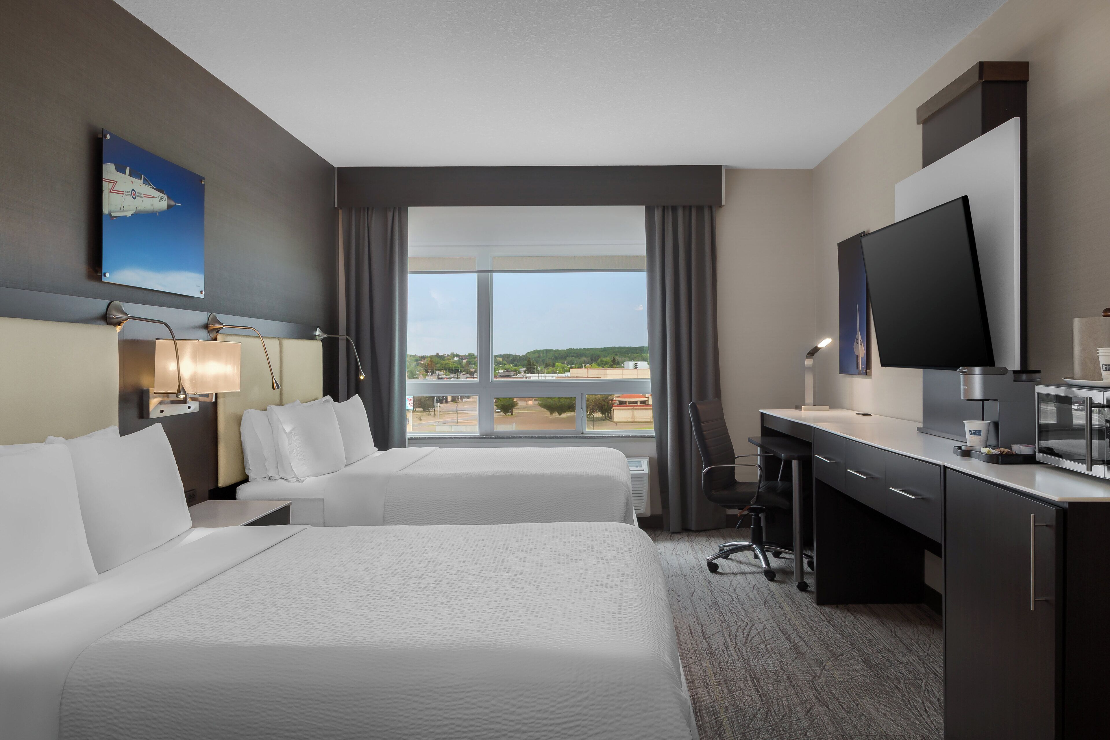 Premium bedding, down comforters, pillowtop beds, in-room safe