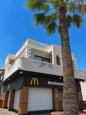 A two-story building with a McDonald's restaurant on the ground floor.