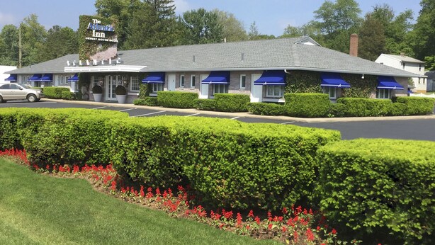 A motel with a sign reading "The Atlantic Inn Luxury Motor Hotel." - Atlantic Inn (Wethersfield)