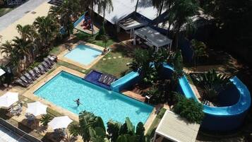 Relax by the resort's main pool, surrounded by lounge chairs and umbrellas, or take a splash down the adjacent slide.