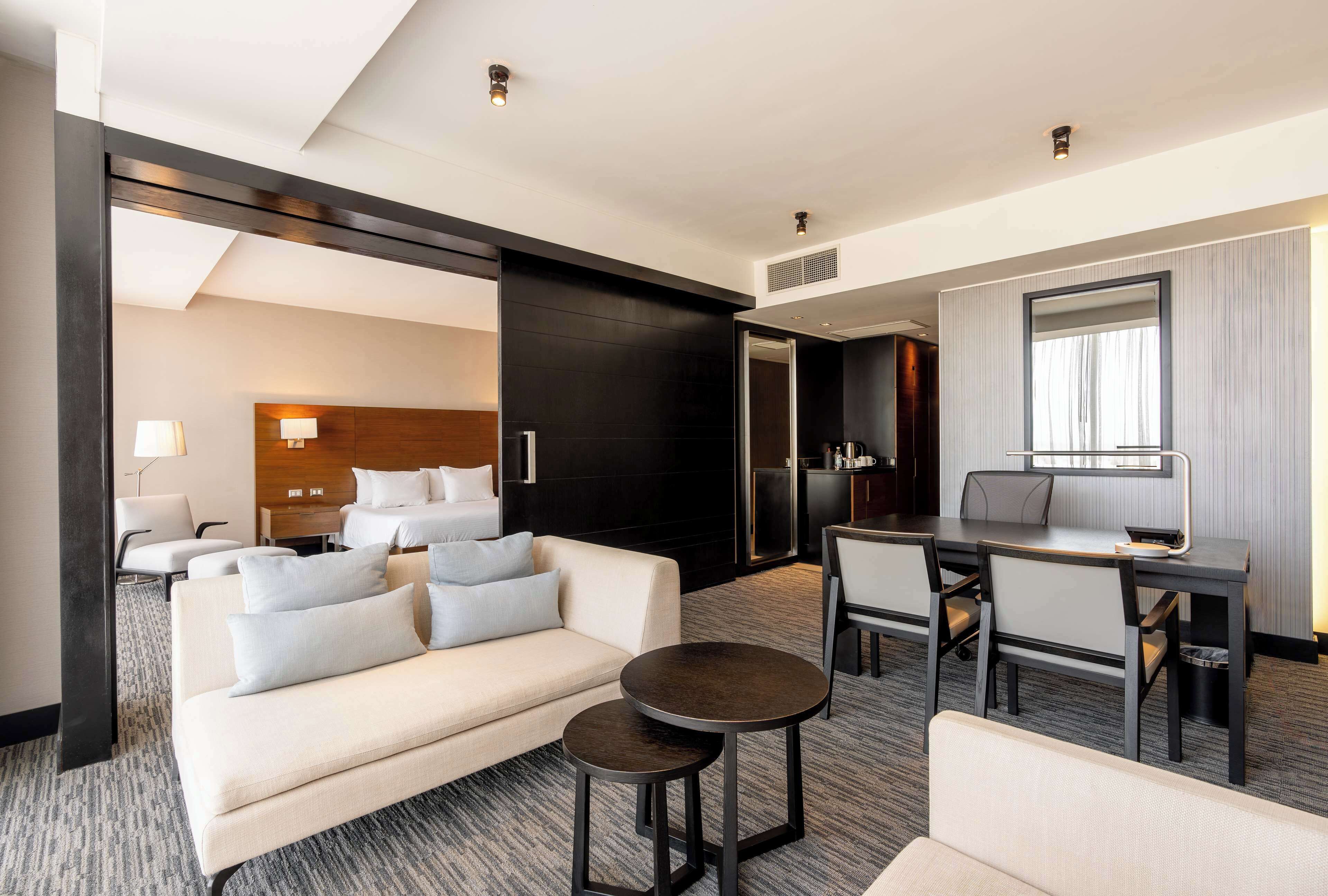 Suite, 1 King Bed | In-room safe, desk, free cribs/infant beds, rollaway beds