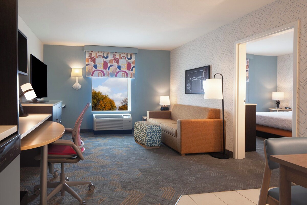 Premium bedding, desk, laptop workspace, iron/ironing board