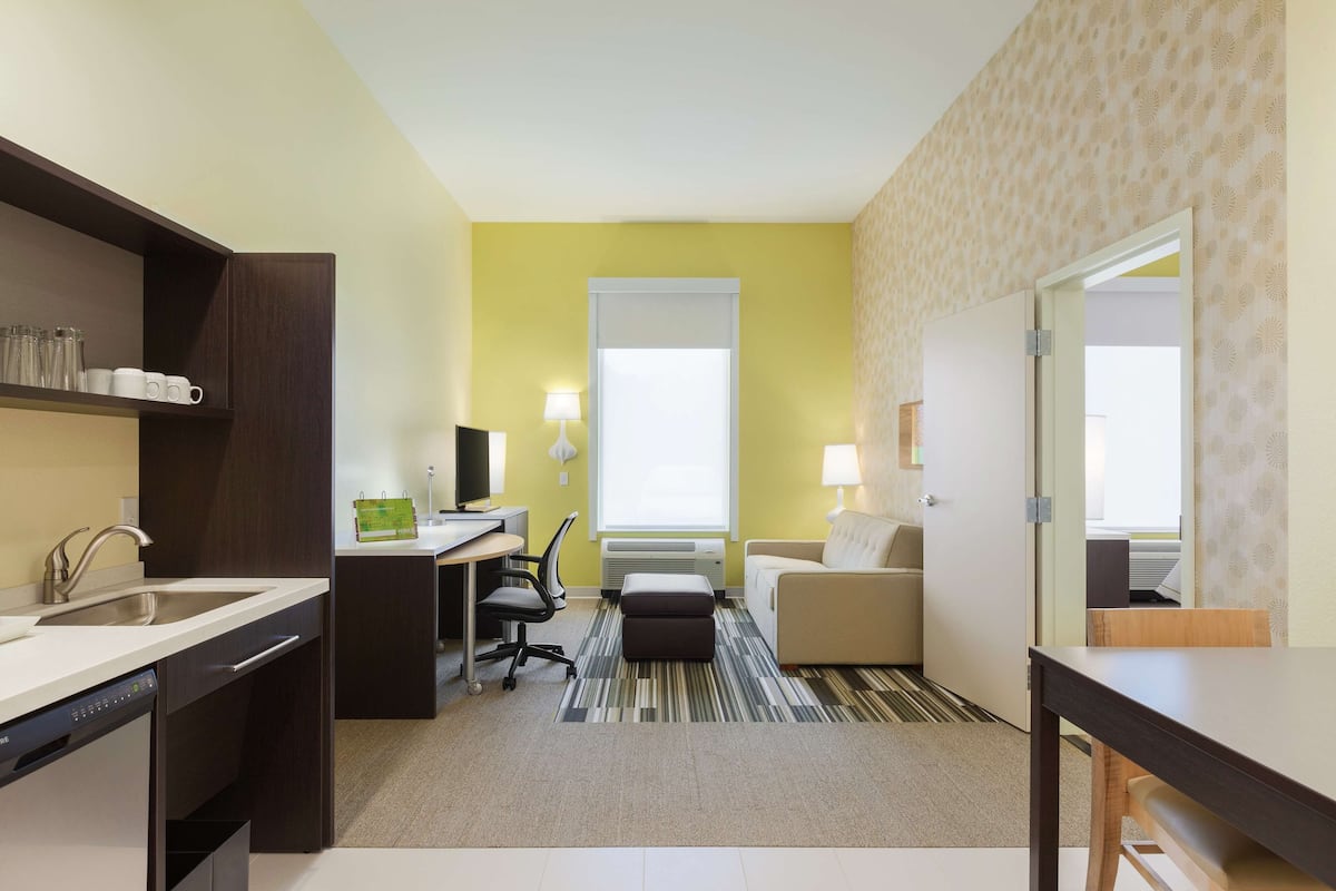 Premium bedding, desk, laptop workspace, iron/ironing board