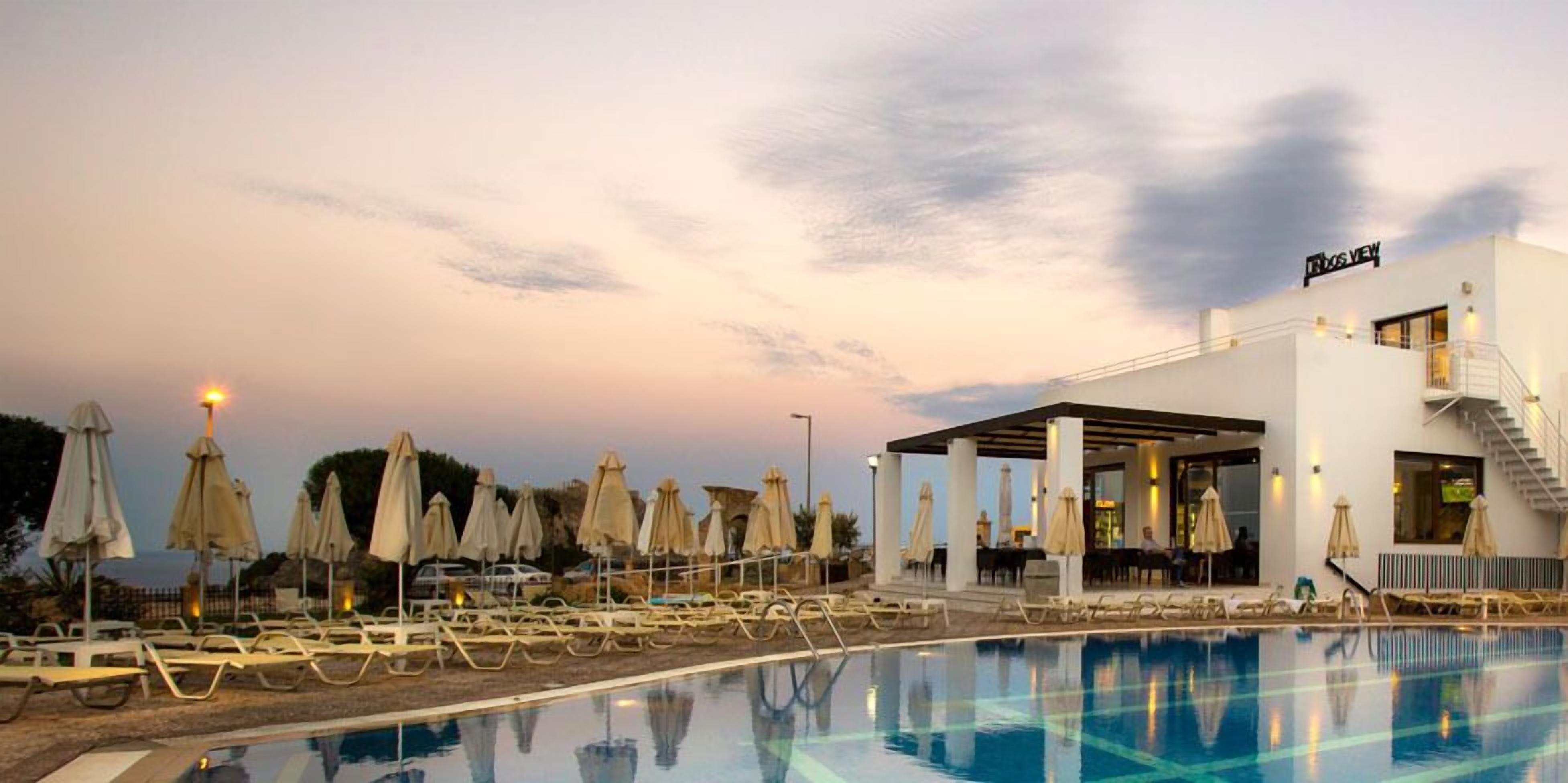 2 outdoor pools, pool umbrellas, pool loungers