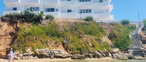 On the beach, sun loungers, beach umbrellas, beach towels
