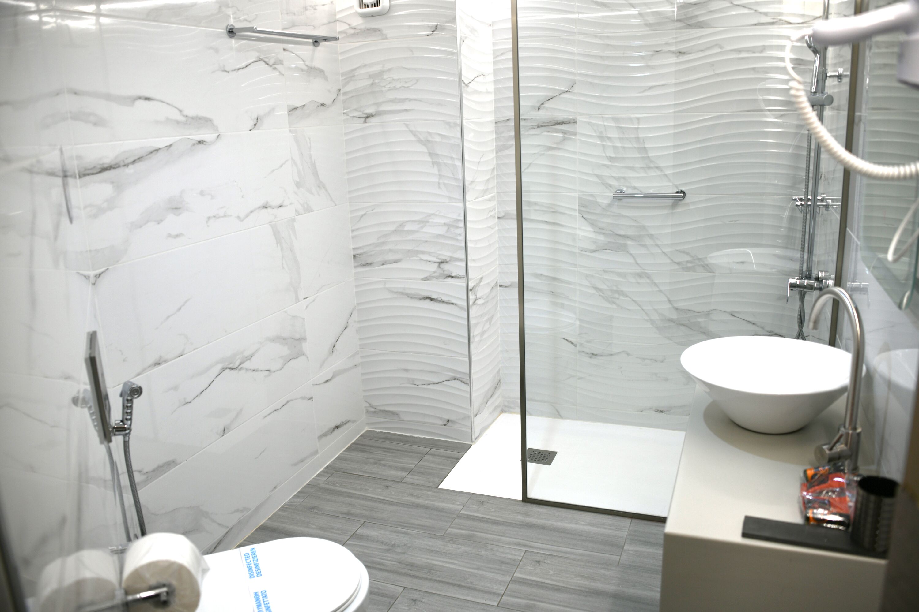 basic quadruple room (economy) | bathroom | shower, free toiletries, hair dryer, towels