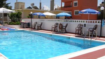 Outdoor pool, pool umbrellas, sun loungers
