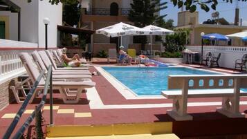 Outdoor pool, pool umbrellas, pool loungers