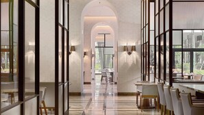 A modern interior with a long corridor, glass partitions, and a dining area with tables and chairs. - Taipei Marriott Hotel (Taipei)