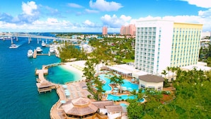 A resort with a large pool, a beach, and a view of the ocean. - Warwick Paradise Island- All Inclusive- Adults Only (Paradise Island)