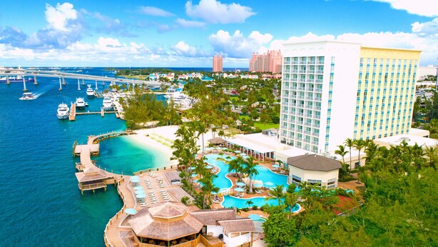 A resort with a large pool, a beach, and a view of the ocean. - Warwick Paradise Island- All Inclusive- Adults Only (Paradise Island)