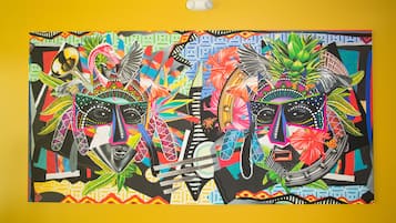 A vibrant mural with abstract patterns and figures.