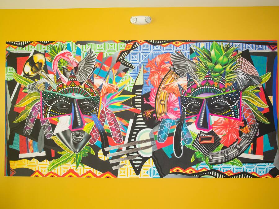 A vibrant mural with abstract patterns and figures.