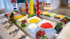 A buffet with various fruits and vegetables arranged on ice. - Warwick Paradise Island- All Inclusive- Adults Only (Paradise Island)