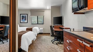 Premium bedding, pillow-top beds, desk, laptop workspace