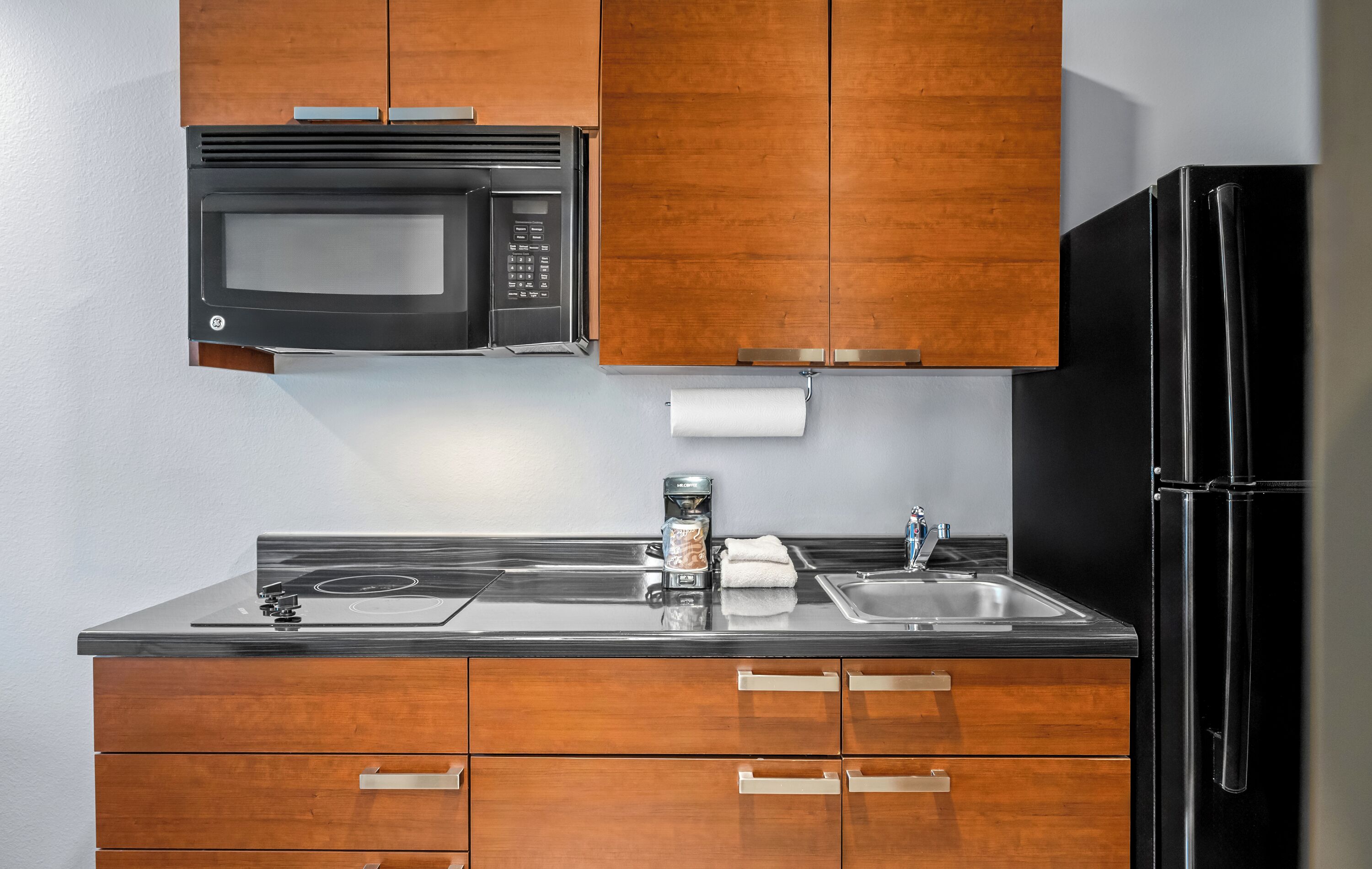 Full-sized fridge, microwave, stovetop, coffee/tea maker