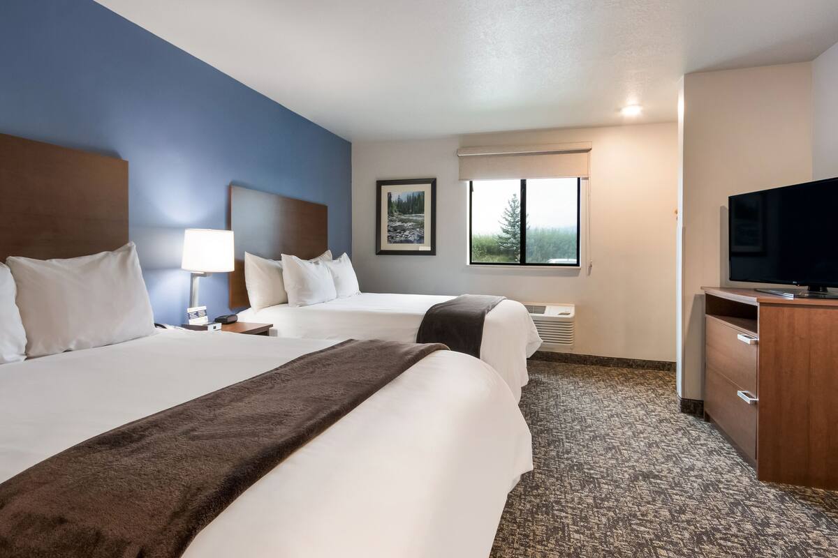 premium bedding, pillow-top beds, desk, laptop workspace