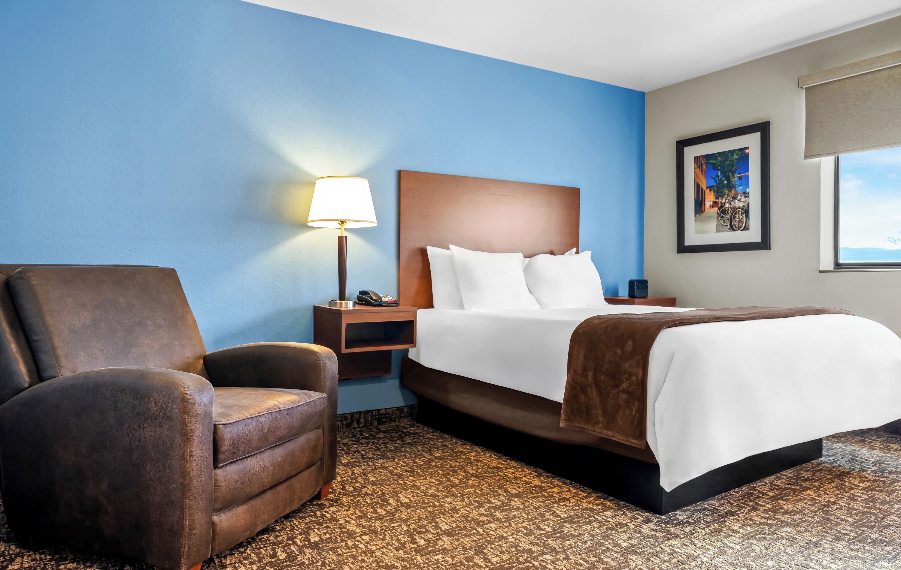 Premium bedding, pillow-top beds, desk, laptop workspace