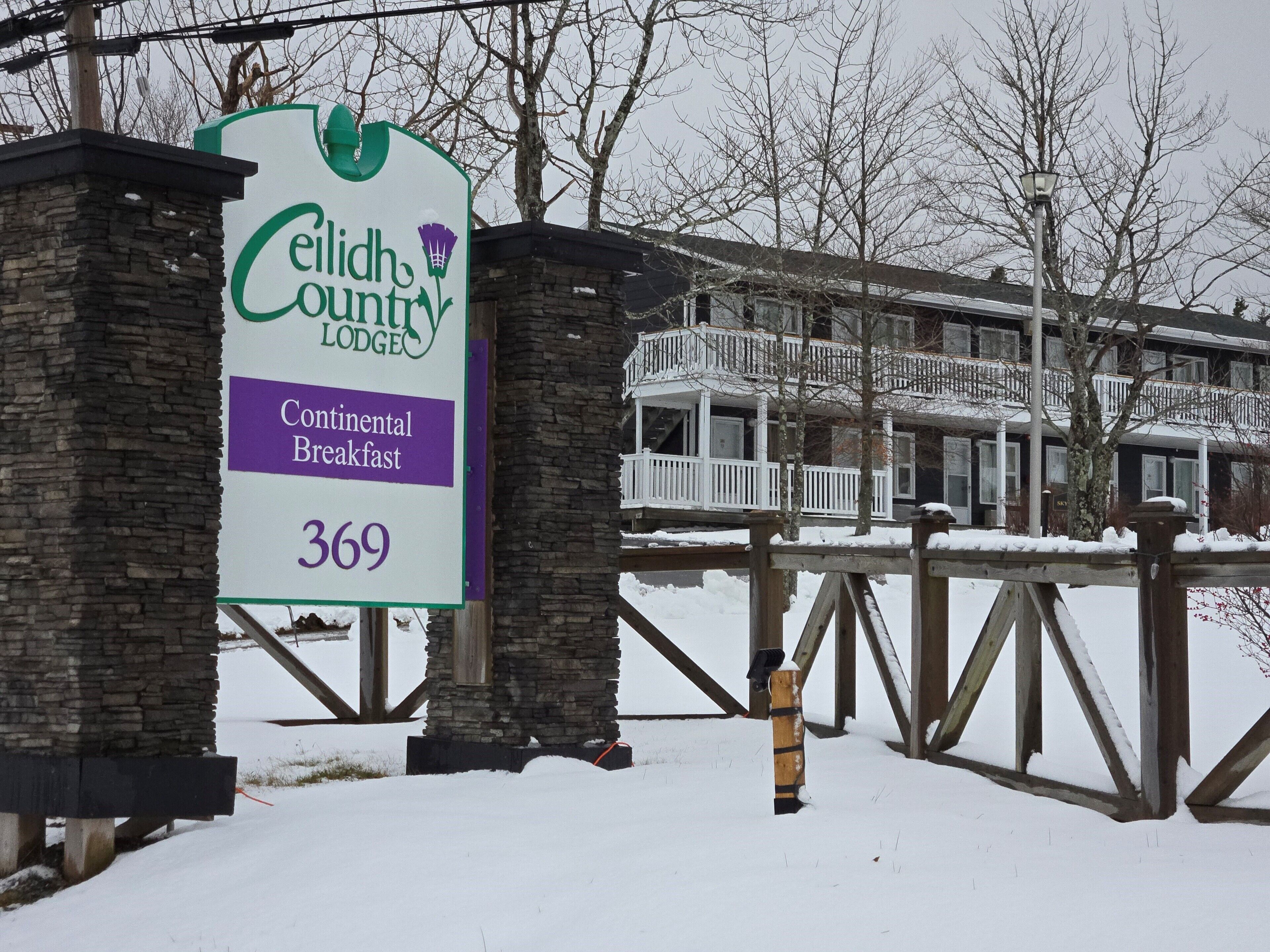 A sign for Celidh Country Lodge advertising continental breakfast and room number 369.